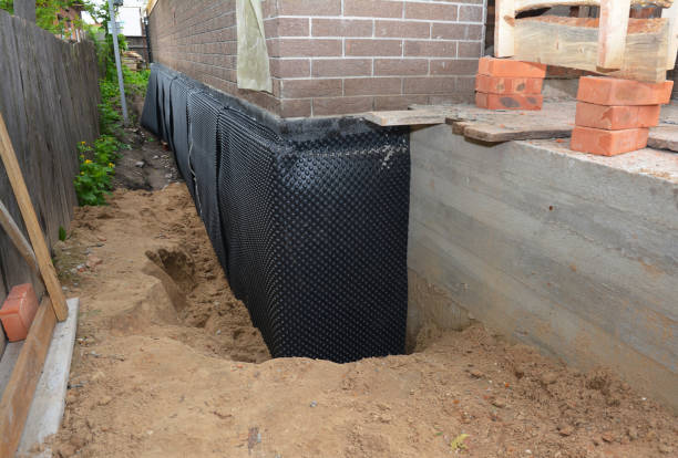 SJ Waterproofing Pros technician performing targeted Exterior Waterproofing assessment in Michigantown, IN